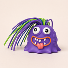 YOWL purple pull-hair desk toy on a neutral background