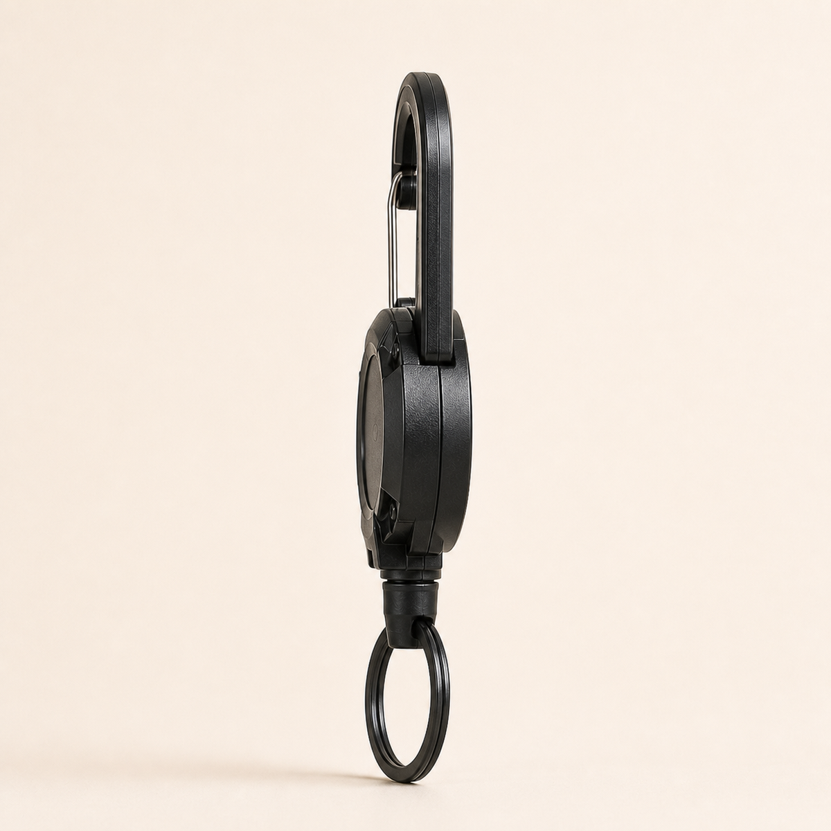 Side profile showing the depth of the TUGLO retractable keychain