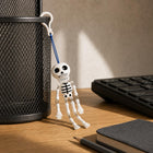 Mr. Bones clipped beside a desk organizer