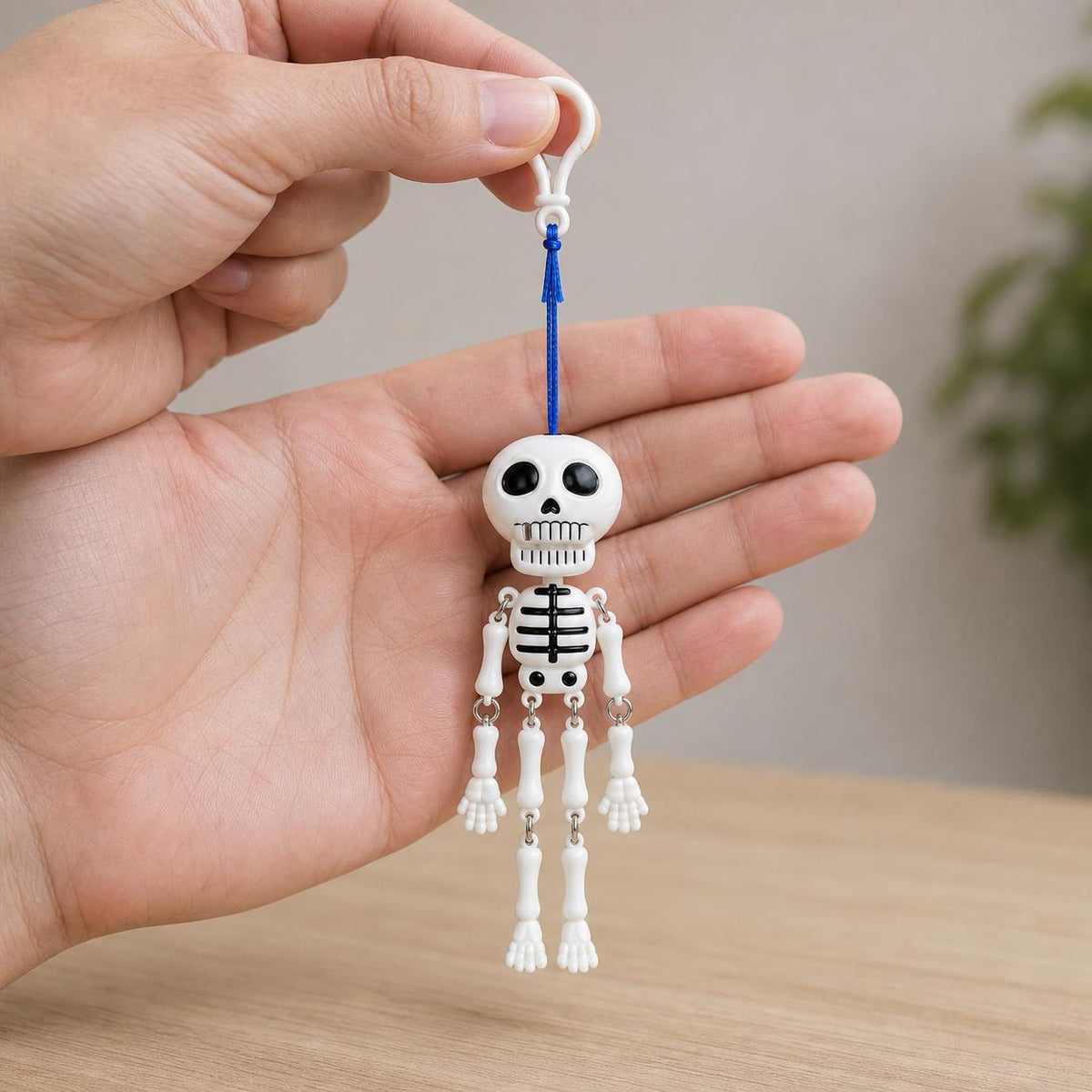 Mr. Bones pull-cord skeleton held in one hand